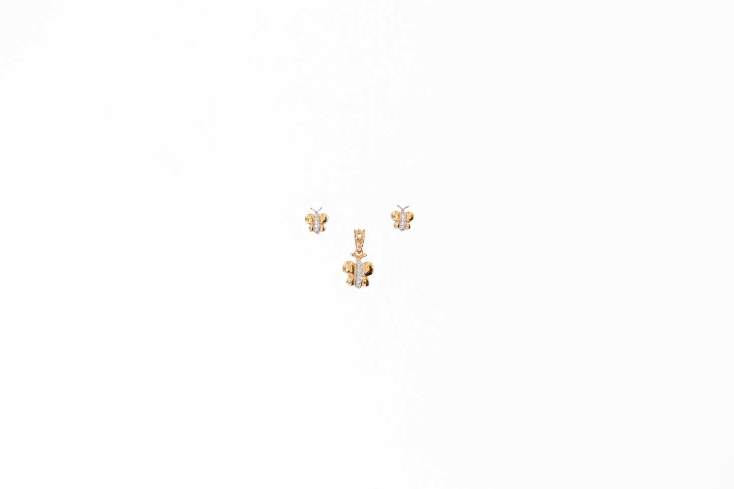 Pair of gold earrings with floral designs on a white background
