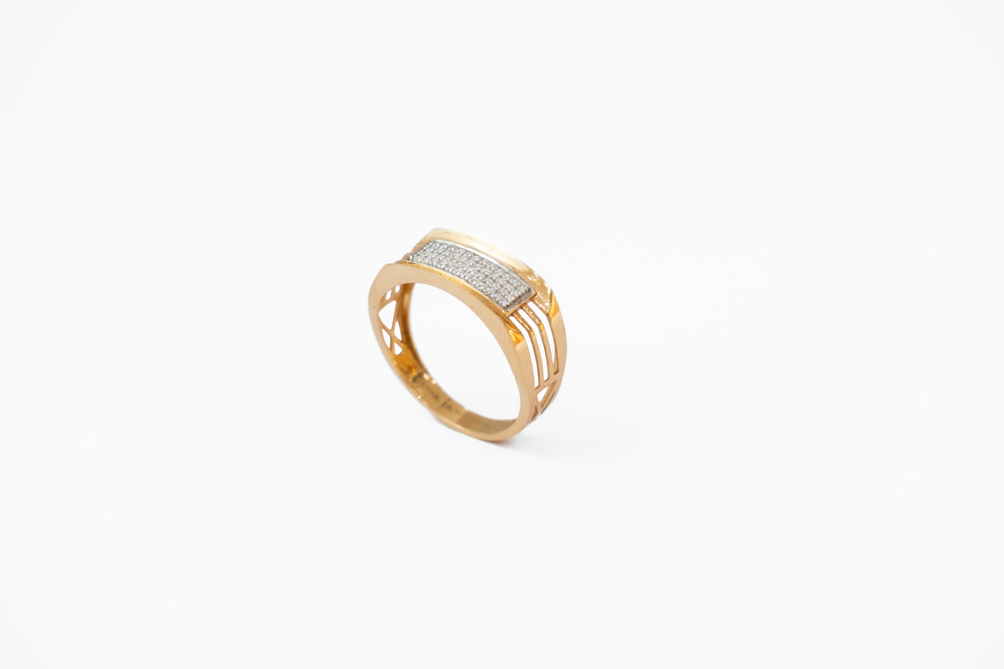 Gold ring with diamond accents on a white background