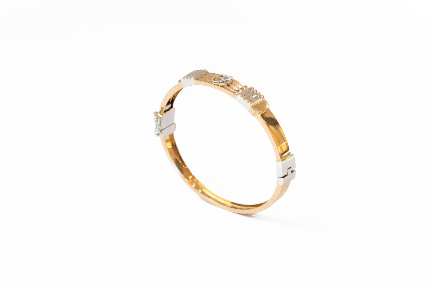 Gold and silver bracelet on a white background