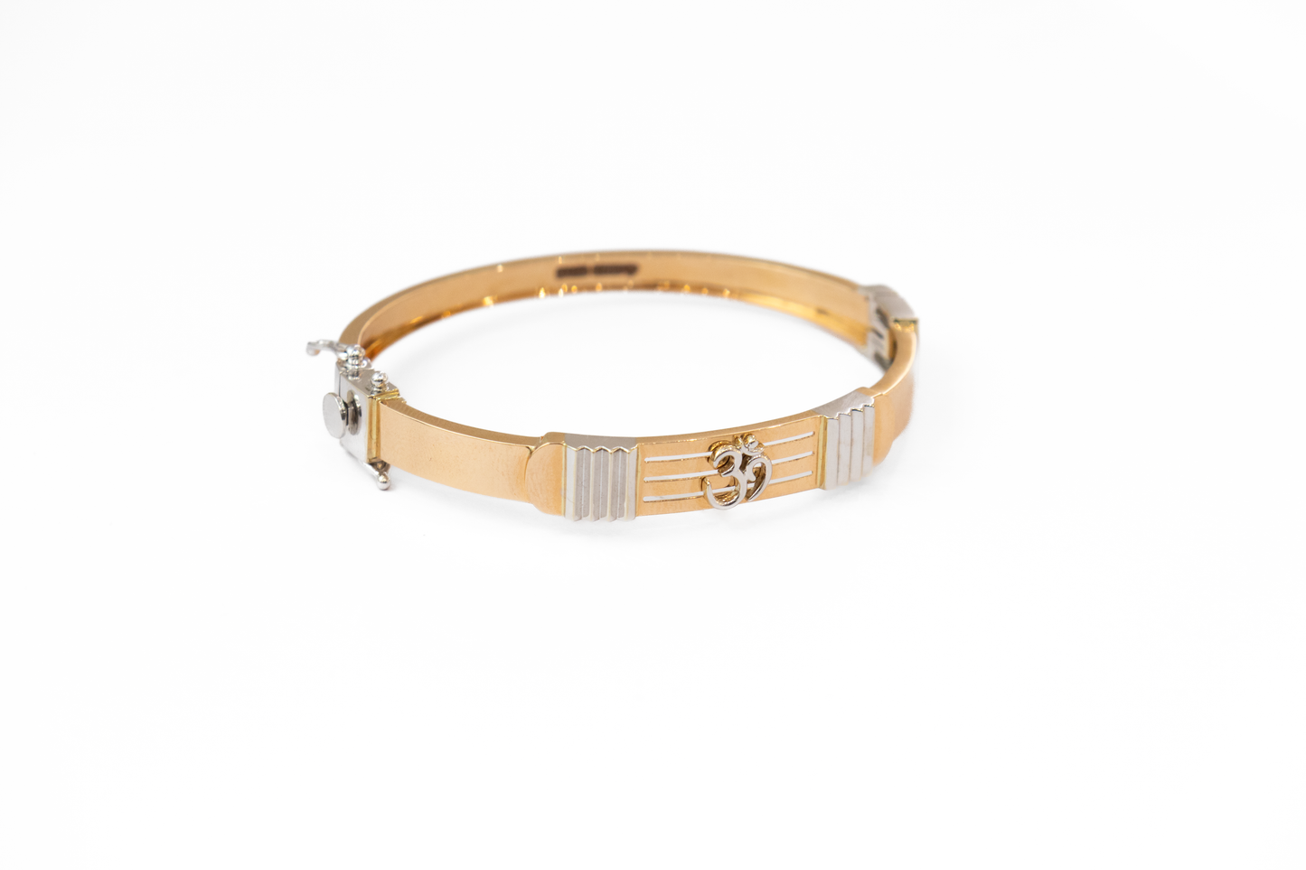 Gold and silver dog collar on a white background