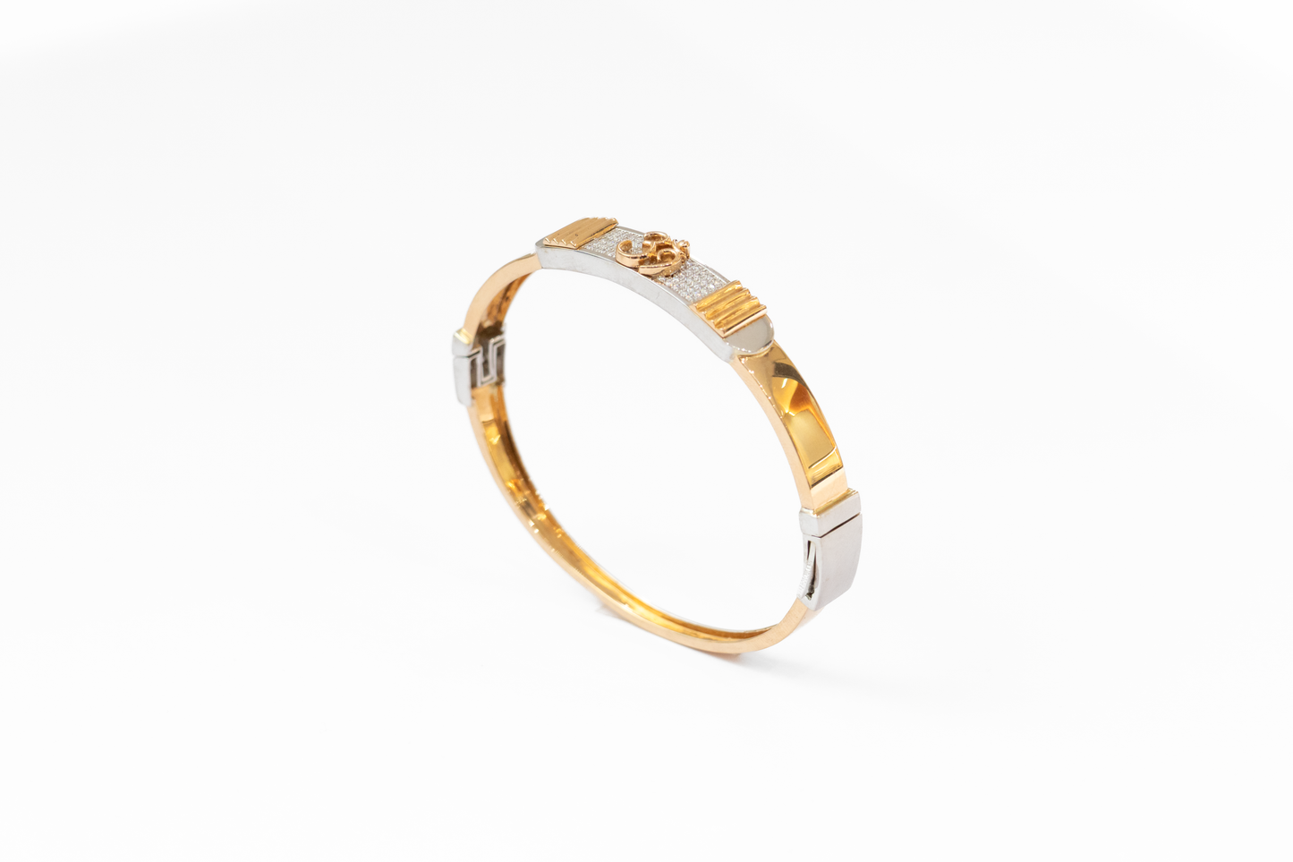 Gold and silver bracelet on a white background