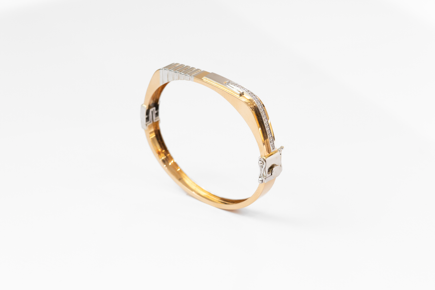 Gold and silver ring on a white background