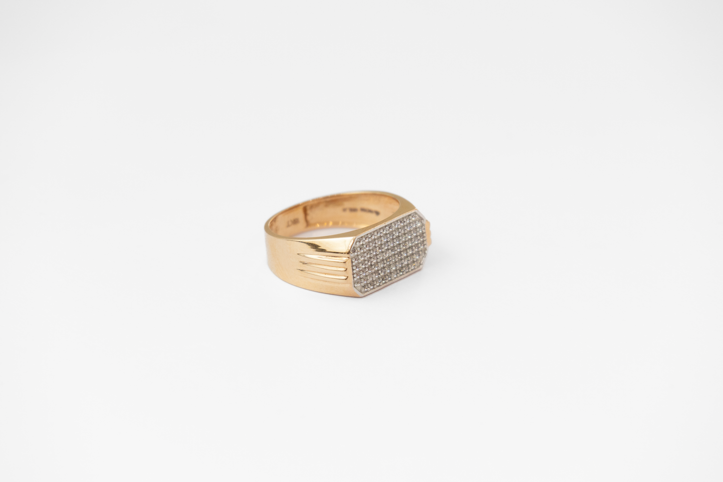 Men Gold ring with diamond accents on a white background