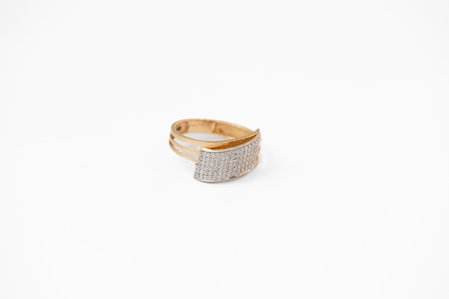 Gold and silver ring on a white background