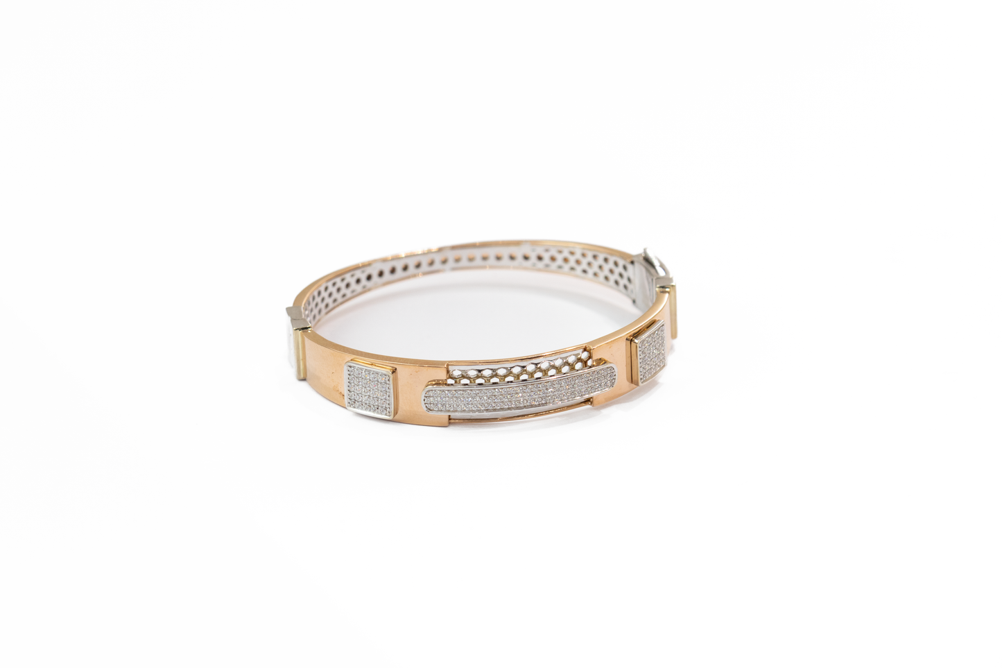 Gold bracelet with diamond accents on a white background
