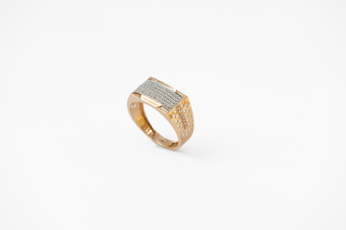 Gold ring with diamond accents on a white background