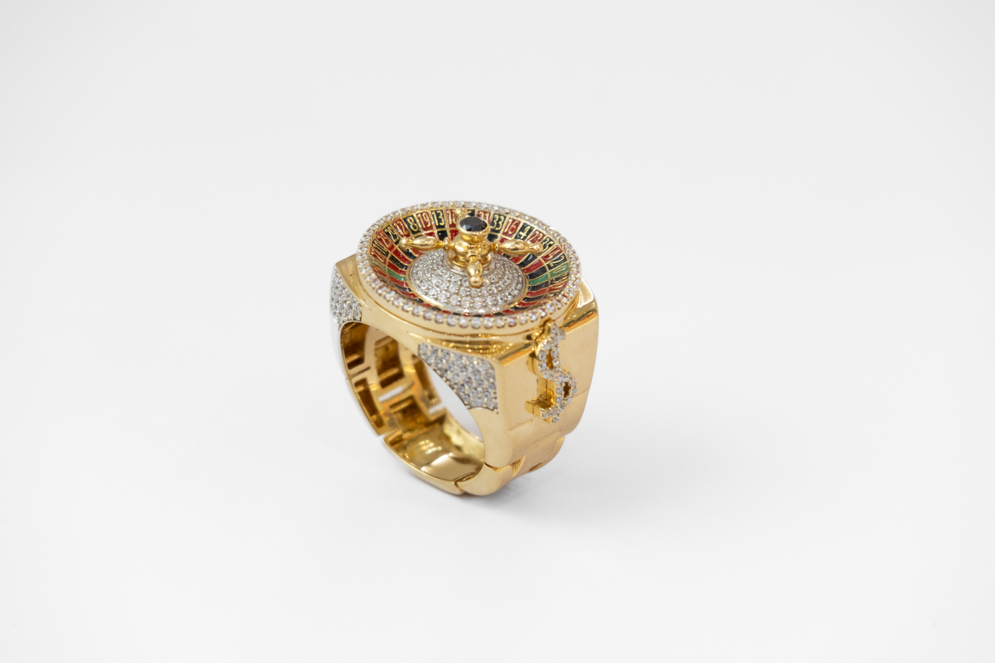 Gold ring with colorful gemstones on a white background